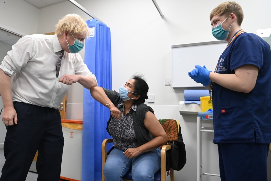 UK Prime Minister Boris Johnson visits the Lordship Lane Primary Care Centre in London on Tuesday to meet staff and see people receiving their booster vaccines. Photo: Daily Telegraph via PA Wire/DPA