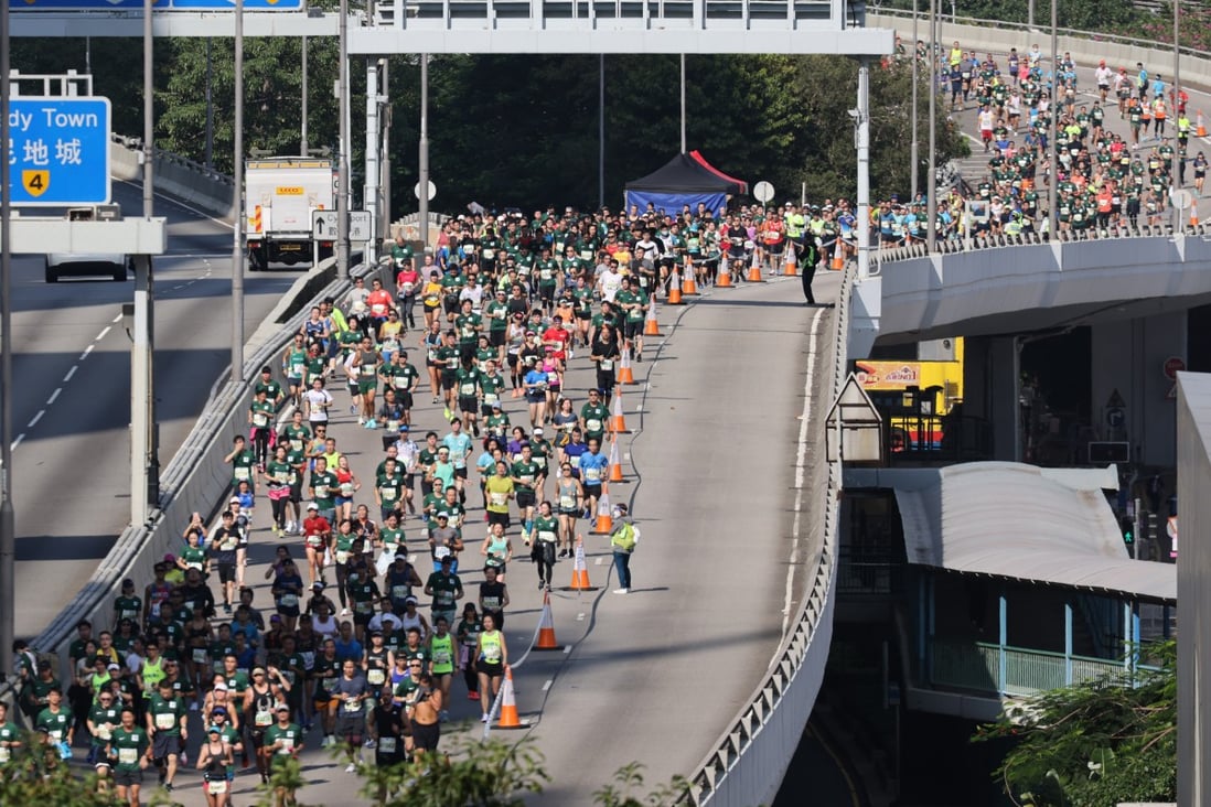 Runners pass through the Connaught Road West flyover at the 2021 Standard Chartered Hong Kong Marathon. Photo: May Tse