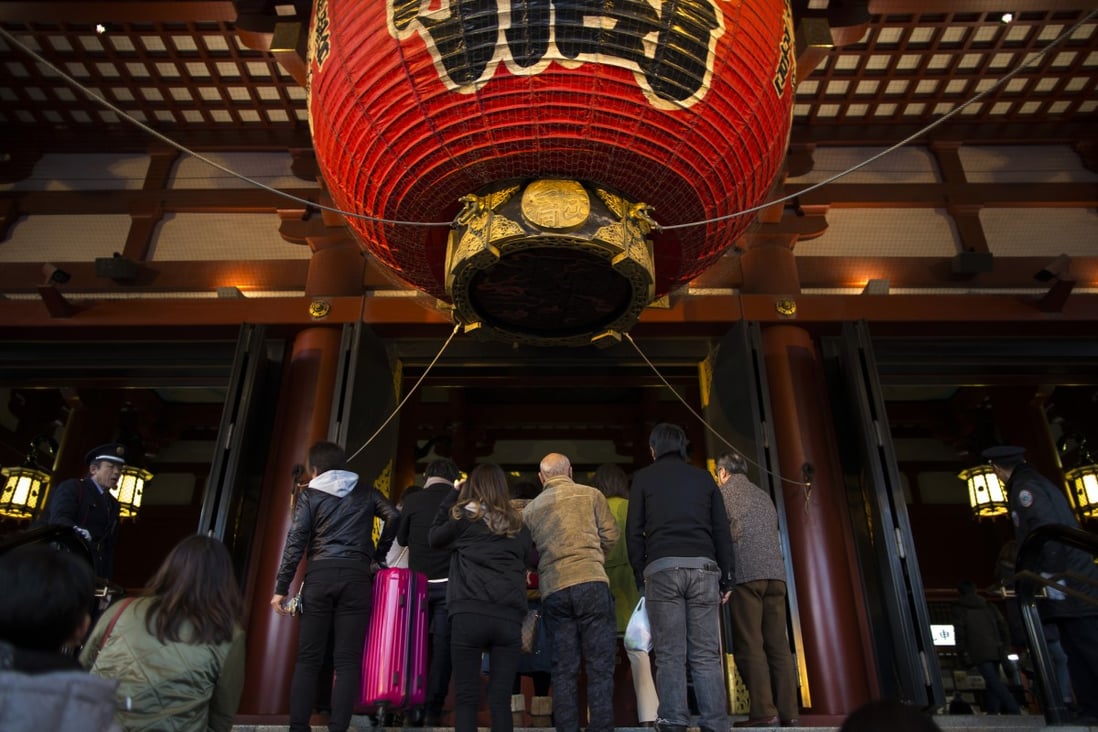 Tourists in the pre-Covid era wait to enter the Sensoji temple in the Asakusa district of Tokyo, Japan. Photo: Bloomberg