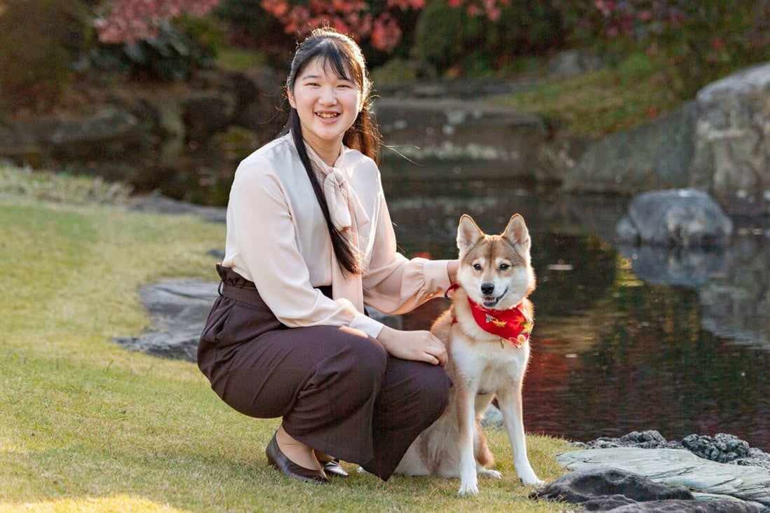 Princess Aiko with her pet dog Yuri: if the 20 year old decides to marry, she’ll be forced to leave the royal family. Photo: AFP