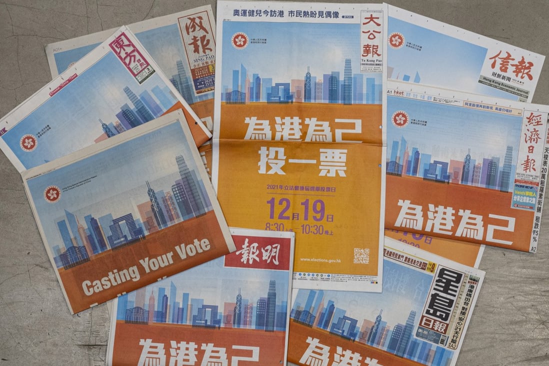 The Hong Kong government has run election advertisements on the front pages of nearly a dozen local newspapers. Photo: Nathan Tsui