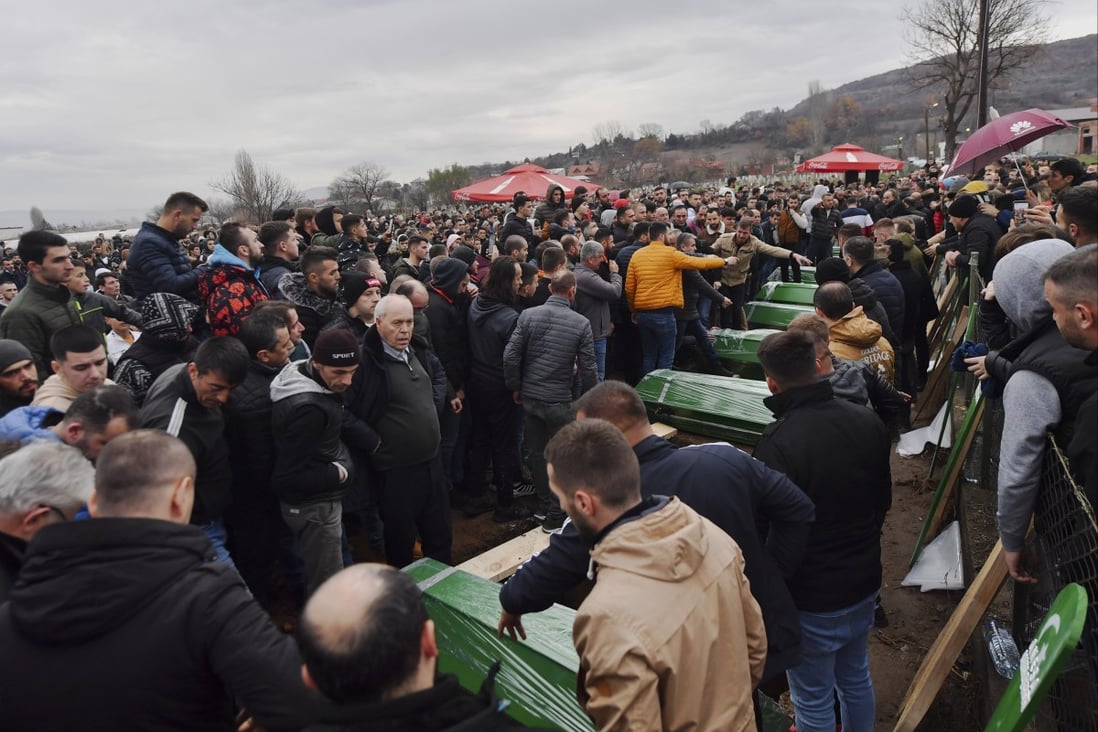 Mourners attend the funeral ceremony of 11 victims of the Jahi family who died in a bus accident, in the village of Morane, near Skopje, Republic of North Macedonia on Friday. Photo: EPA-EFE