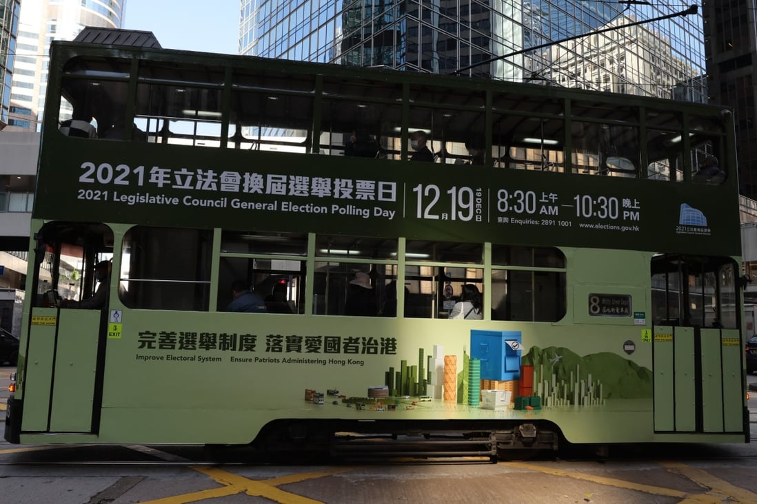 A tram bearing an advertisement for this month’s Legislative Council poll passes through Central. Photo: Nora Tam