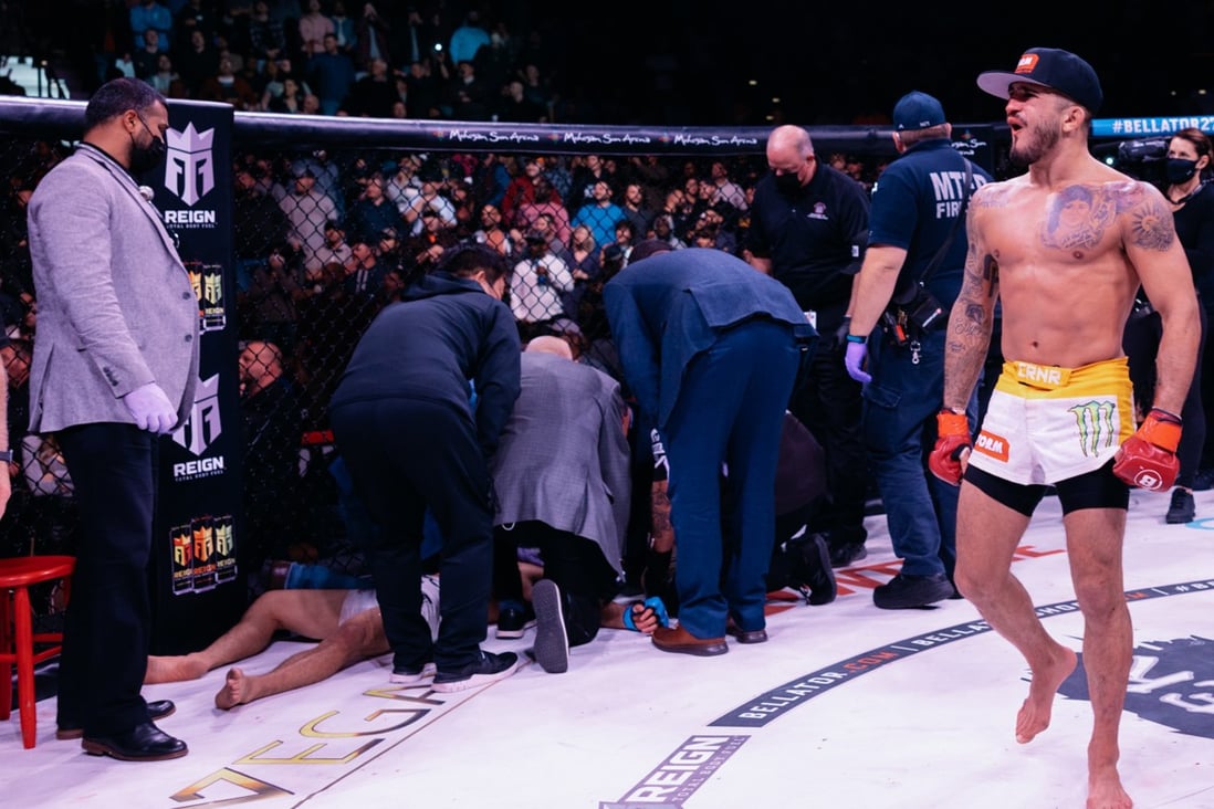 Sergio Pettis celebrates as medical officials tend to Kyoji Horiguchi at Bellator 272. Photos” Bellator MMA