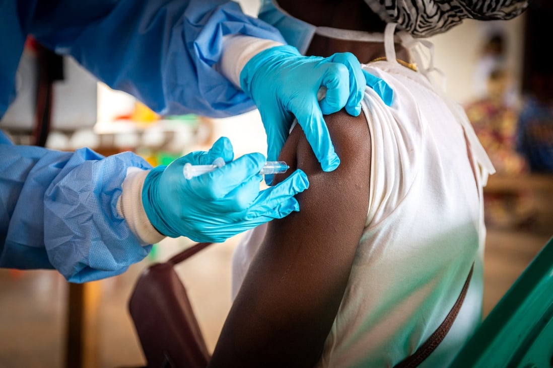A health worker administers a dose of Covid-19 vaccine to a person in Bimbo, near Bangui, Central African Republic on November 15. How will legal obligations under a treaty ensure we detect and introduce emergency protections early or develop and distribute vaccines equitably? Photo: AFP