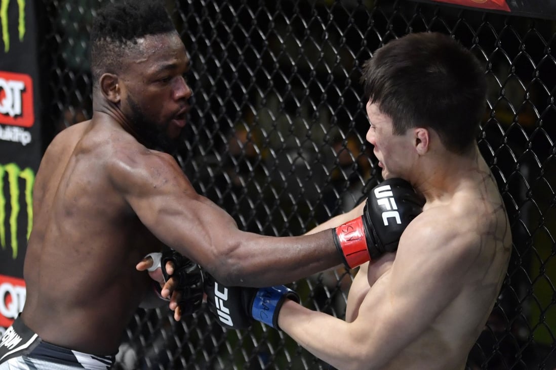 Manel Kape punches Zhalgas Zhumagulov in their flyweight fight at UFC Vegas 44. Photos: Jeff Bottari/Zuffa LLC