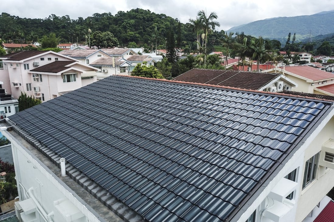 A house with a solar panel-covered rooftop at Hong Lok Yuen in Tai Po in July 2019. Using open space for solar panels and wind farms is one way Hong Kong can help the world achieve its climate change goals. Photo: Winson Wong