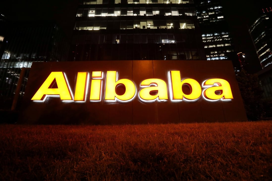 The logo of Alibaba Group lit up at its office building in Beijing on August 9. Photo: Reuters