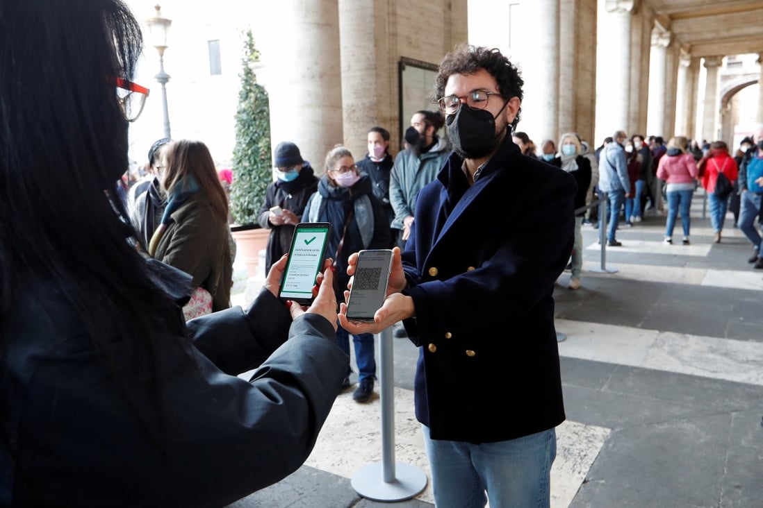 A visitor has their coronavirus health pass, known as green pass, checked at the entrance to the Musei Capitolini in Rome, Italy. Photo: Reuters