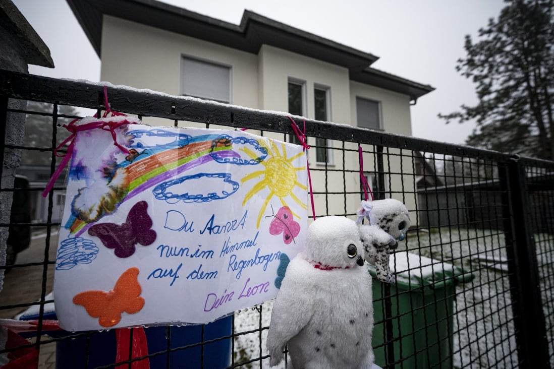 A message and soft toys at a German house, scene of a family killing. Photo: AP