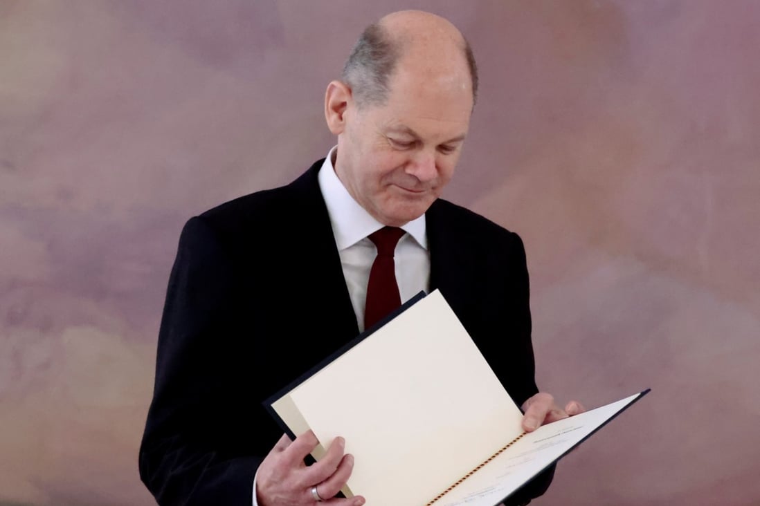 Newly-elected German Chancellor Olaf Scholz receives his certificate of appointment from German President Frank-Walter Steinmeier. Photo: Reuters