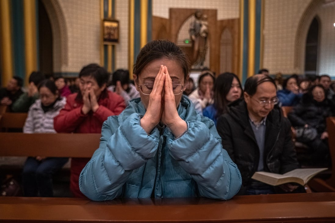 Chinese Catholics attend a Christmas Eve mass at a church in Beijing. Christianity took root in China in the 16th century thanks to Jesuit missionaries who made converts of prominent people, but first reached China nearly 1,000 years earlier. Photo: EPA-EFE