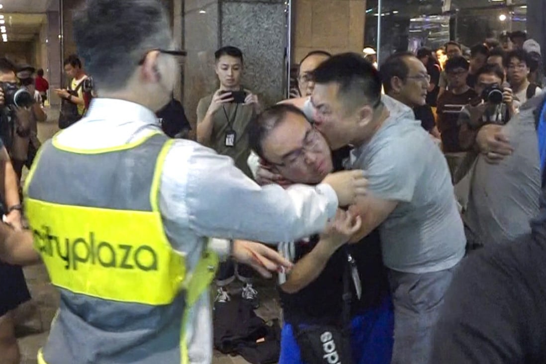 Defendant Joe Chen, found guilty on Wednesday, bites the ear of then district councillor Andrew Chiu in November 2019. Photo: Handout