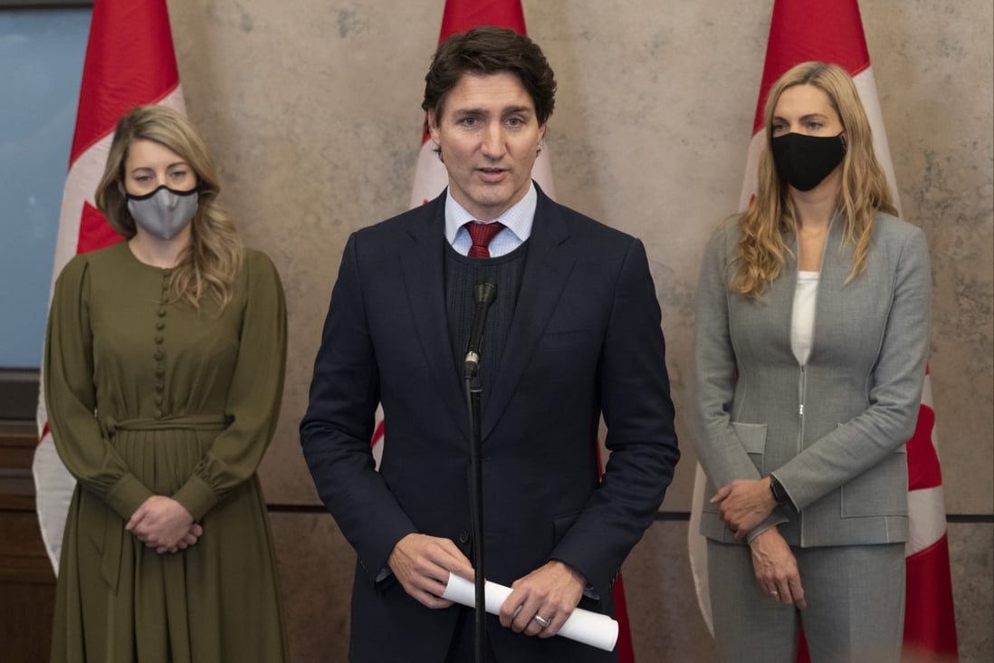Canadian Prime Minister Justin Trudeau announces Canada will join a diplomatic boycott of the Beijing Winter Olympics over human rights concerns, at a press conference in Ottawa on Wednesday. Looking on are Foreign Affairs Minister Melanie Joly (left) and Sports Minister Pascale St-Onge. Photo: AP 
