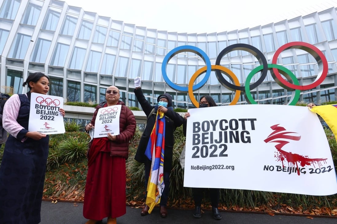 Protesters calling for a boycott of the Beijing Games demonstrate outside the International Olympic Committee in Switzerland. Photo: Reuters