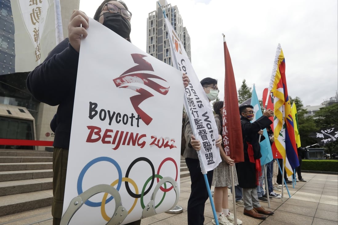 Demonstrators gathered in front of the Bank of China building in Taipei on United Nations Human Rights Day on Friday to call for the boycott the Beijing Winter Olympics. Photo: AP