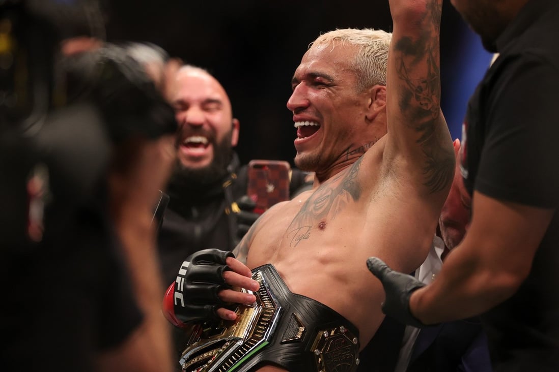 Charles Oliveira of Brazil celebrates after defeating Dustin Poirier to defend his lightweight title at UFC 269. Photo: Carmen Mandato/Getty Images/AFP