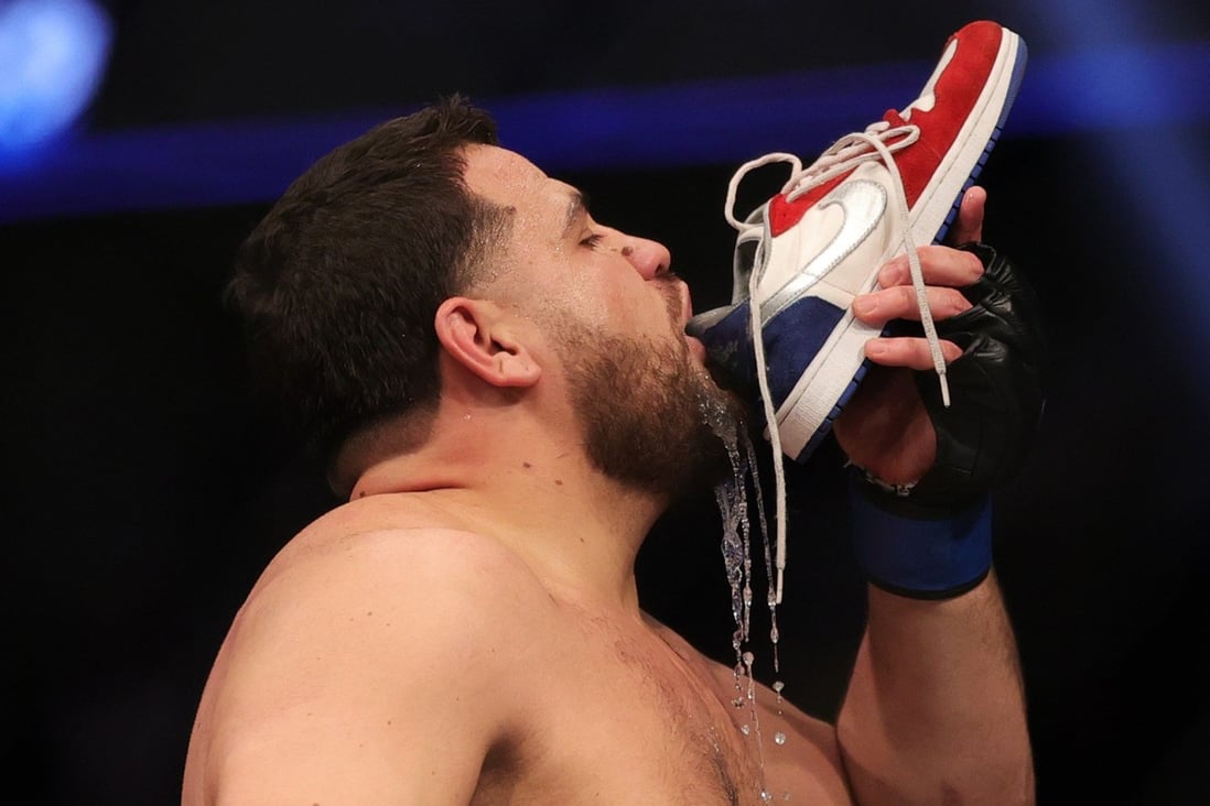 Tai Tuivasa drinks from his shoe as he celebrates his knockout victory over Augusto Sakai at UFC 269 in Las Vegas, Nevada. Photo: AFP