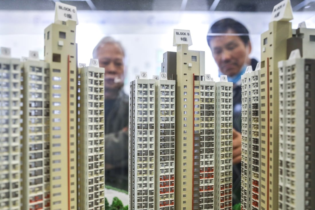 Potential homebuyers look at a scale model of Home Ownership Scheme flats at the Customer Service Centre of the Housing Authority in Lok Fu on December 9, 2019. Photo: SCMP / Dickson Lee