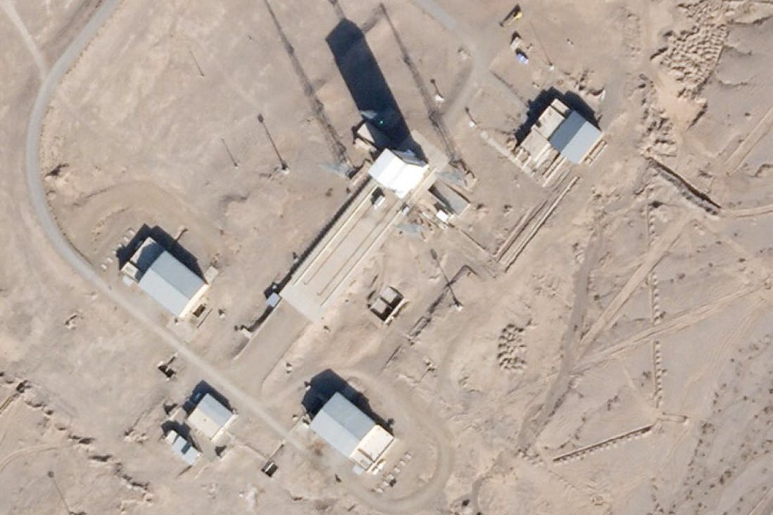 Satellite image shows a support vehicle parked alongside a massive white gantry that typically houses a rocket, on the launch pad at Iran’s Imam Khomeini Spaceport. Photo: Planet Labs via AP
