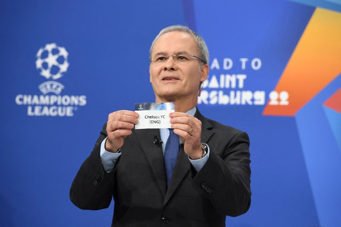 Uefa deputy general secretary Giorgio Marchetti pulls out the card of Chelsea during the first attempted draw. Photo: Reuters