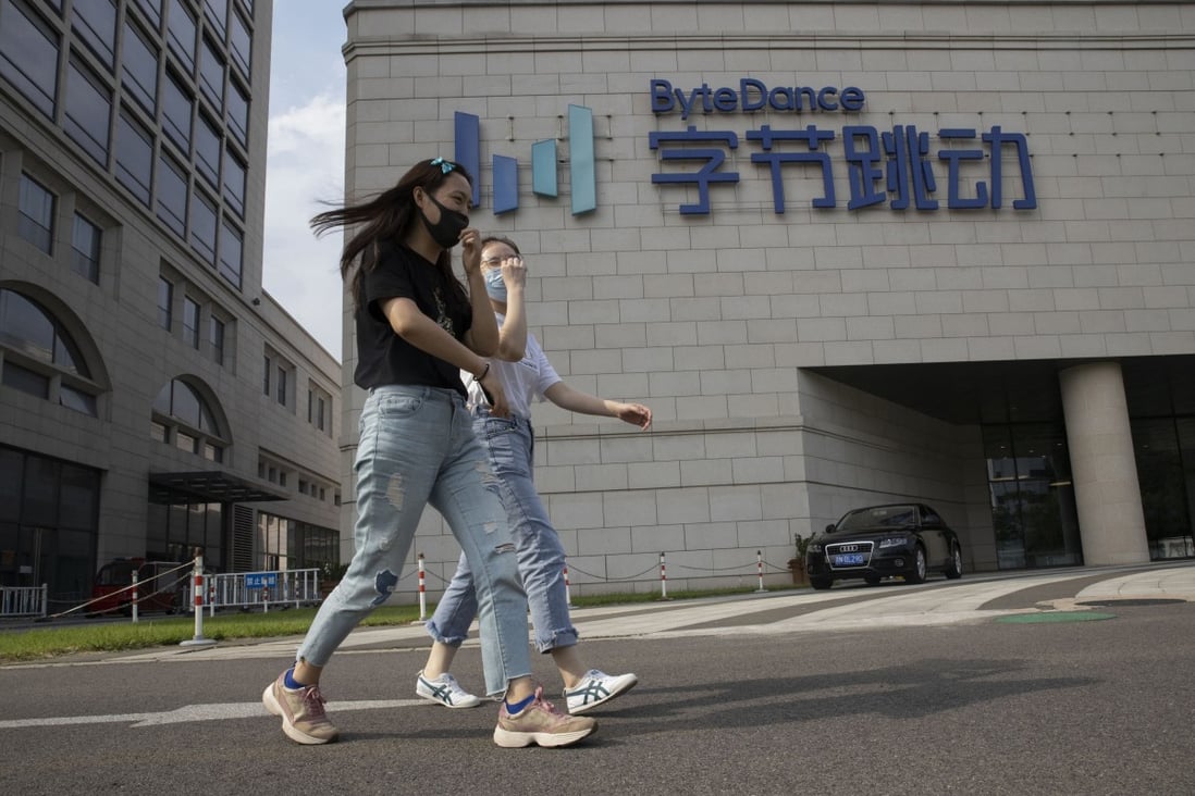 Pedestrians pass by the ByteDance headquarters in Beijing. The company’s Feiliao social app is no longer available for download. Photo: AP Photo