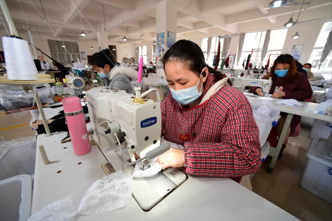 Workers at a clothing manufacturer in Jianhe County, southwest China’s Guizhou Province, March 1, 2020. Photo: Xinhua