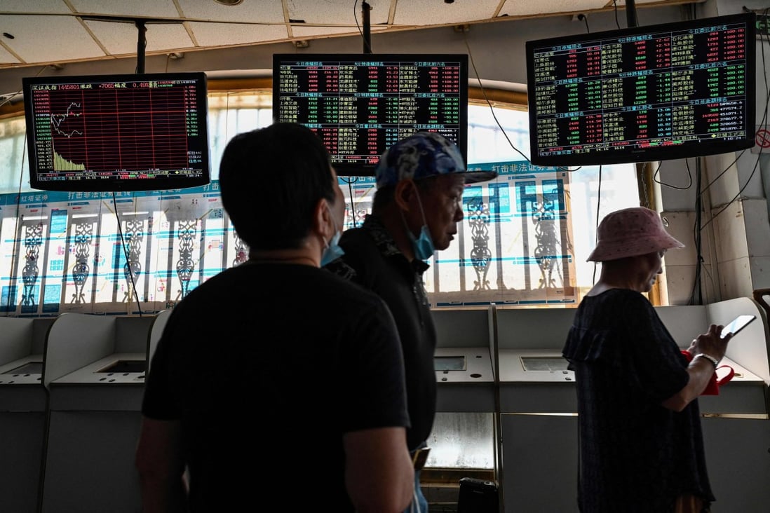 Investors monitor stock price movements at a securities company in Shanghai in September 2021. Photo: AFP