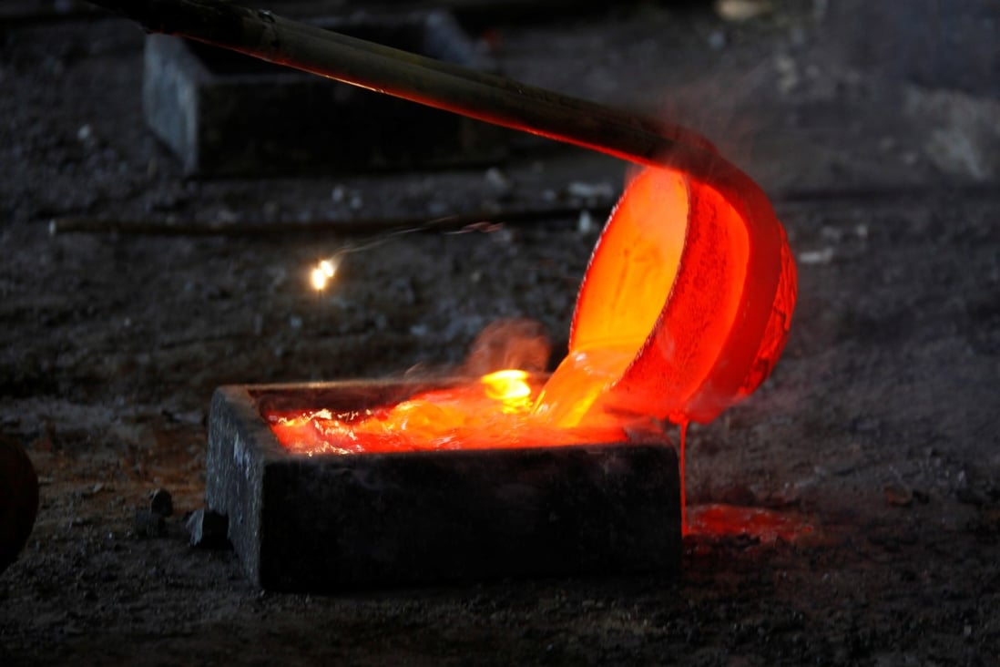 Molten rare earth metal is poured into a mould at a smelting workshop in Inner Mongolia. Photo: Reuters