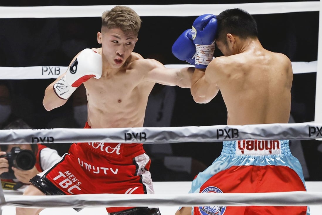 WBA and IBF bantamweight champion Naoya Inoue (left) jabs Thailand’s Aran Dipaen during the second round of their boxing world title match in Tokyo. Photo: Kyodo