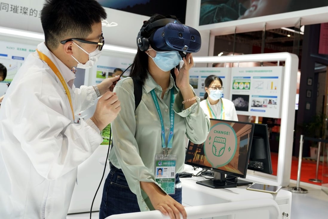 A visitor experiences a virtual reality headset at the 4th China International Import Expo in Shanghai on November 6. China’s innovative economy is mostly market-oriented rather than state-driven. Photo: Xinhua