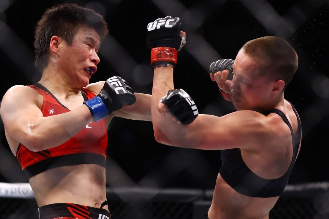 Rose Namajunas punches Zhang Weili in their strawweight title bout at UFC 268. Photo: AFP