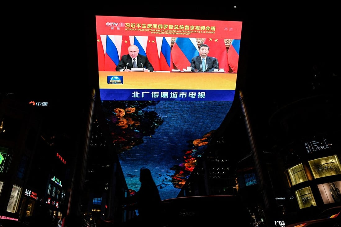 An outdoor screen in Beijing shows a news programme of a virtual meeting between Chinese President Xi Jinping and Russian President Vladimir Putin. Photo: AFP