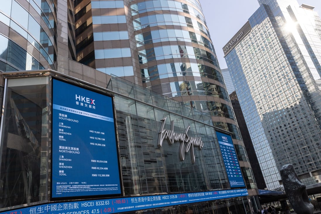 Electronic billboards displaying stock transactions outside the Exchange Square in Central, Hong Kong on November 30. Photo: EPA-EFE