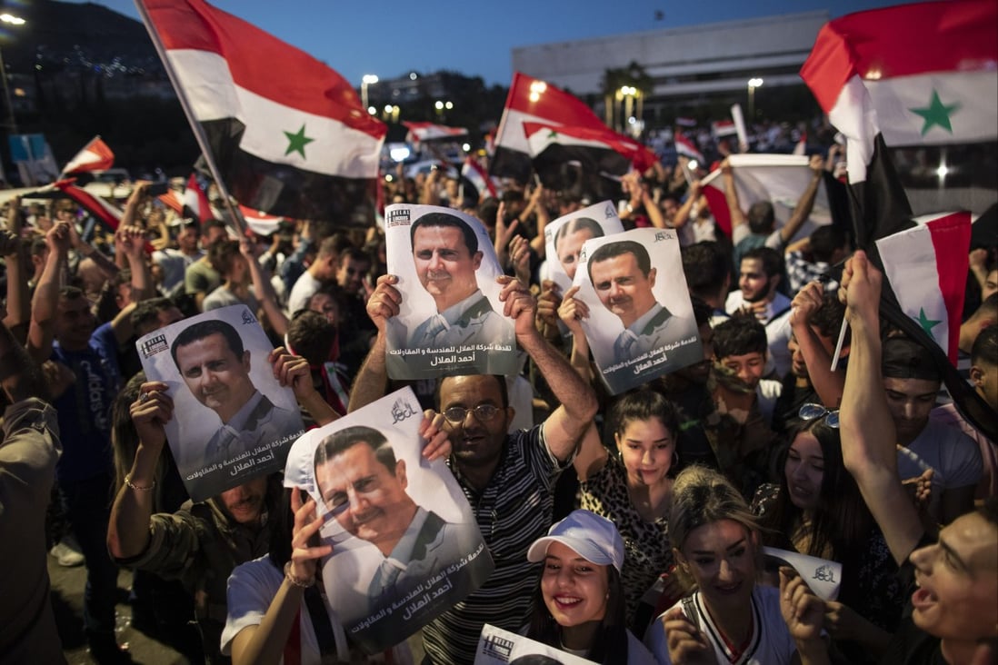 Supporters of Syrian President Bashar al-Assad in Omayyad Square, Damascus. Photo: AP