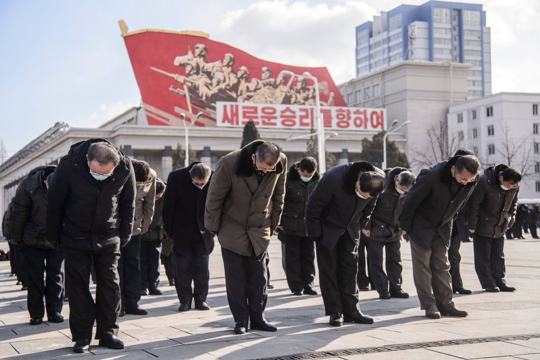People bow during a three- minute silence marking the 10th anniversary of the death of Kim Jong Il, the father of North Korea’s current leader Kim Jong Un, in Pyongyang on December 17. Photo: AFP