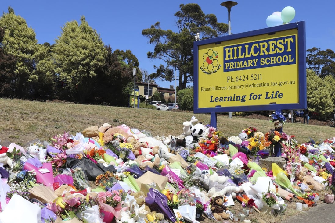 Flowers and tributes are seen outside Hillcrest Primary School in Tasmania. Photo: AAP Image via AP 