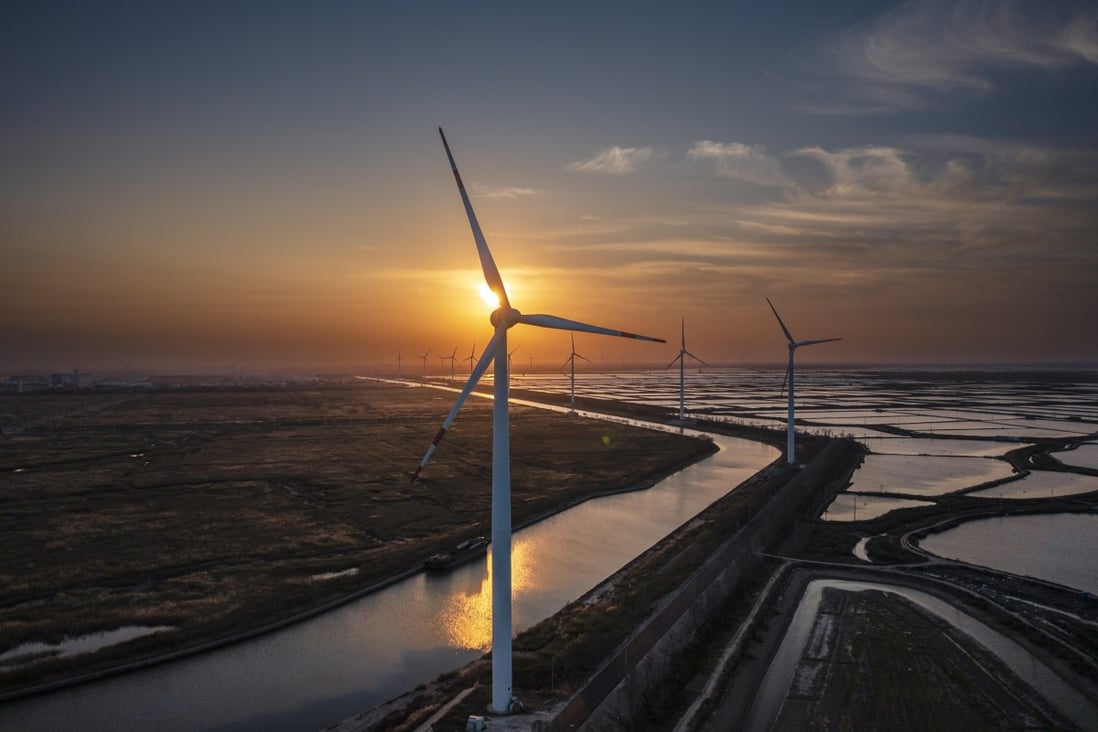 If renewable sources like wind power are developed, alongside energy storage and demand-side response, the sector could achieve peak emissions by 2025, researchers say. Photo: EPA-EFE