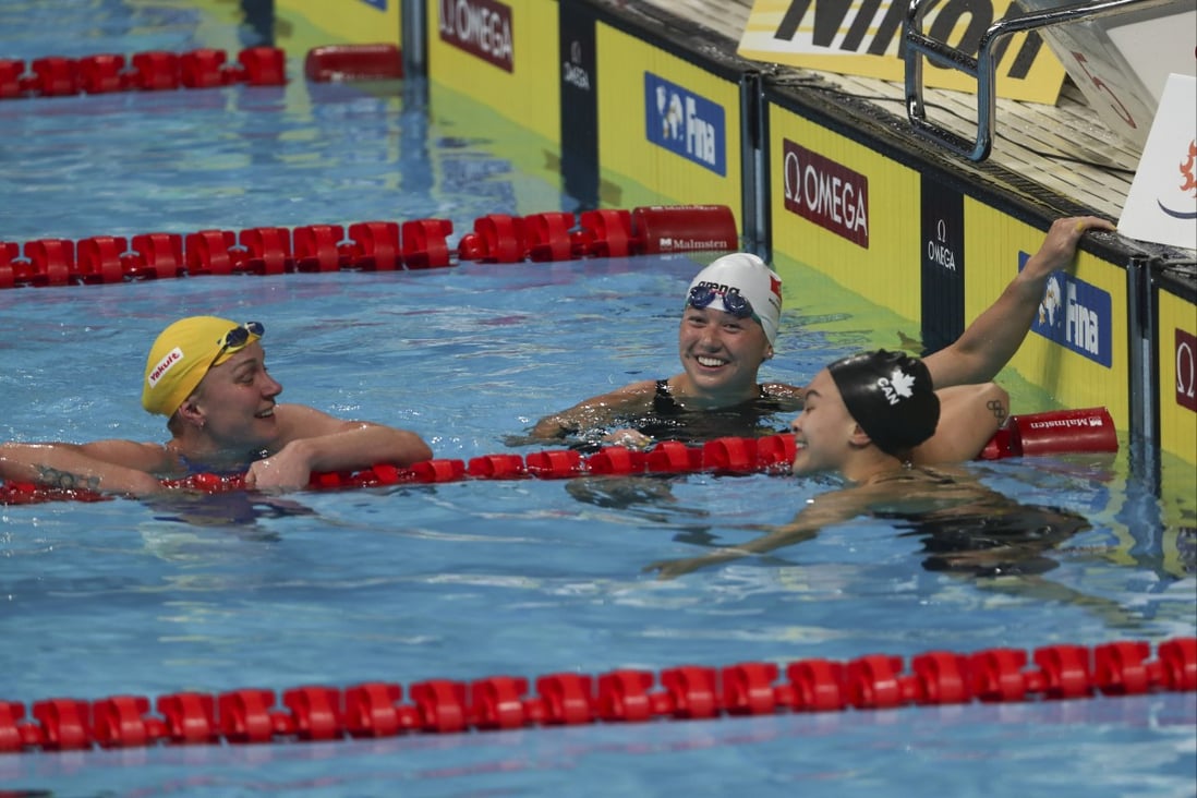 Siobhan Haughey (centre) celebrates her 100m freestyle World Championshps victory with second-placed Sarah Sjostrom (left) and fifth-placed Canadian Kayla Sanchez. Photo: AP