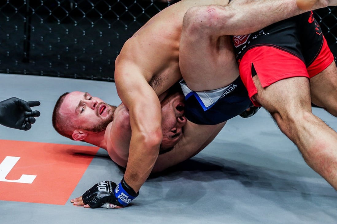Vitaly Bigdash submits Fan Rong with a third-round guillotine choke. Photos: Dux Carvajal/ONE Cahmpionship
