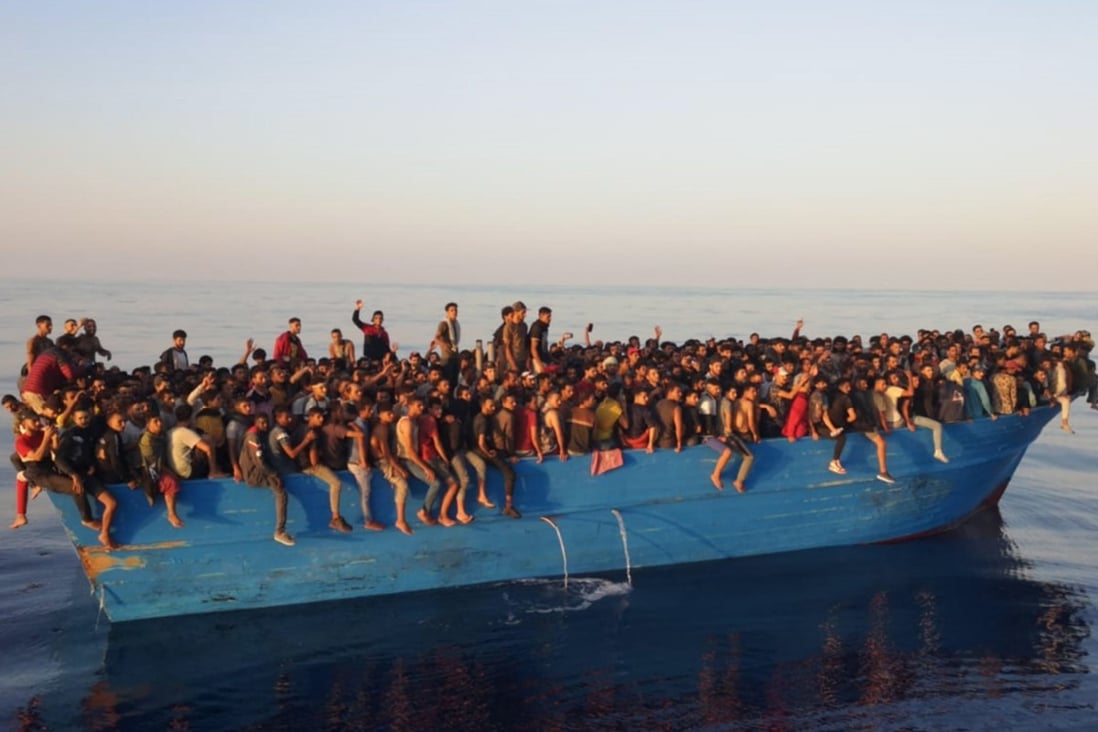 Around 400 migrants on a boat off the Italian island of Lampedusa in August 2021. They made it to shore but some 1,340 people have died attempting the perilous Central Mediterranean crossing this year, according to the International Organisation for Migration (IOM). Photo: EPA-EFE