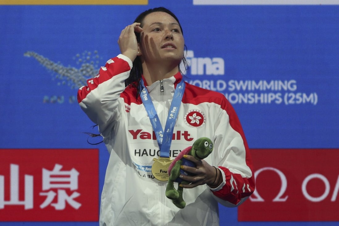 Siobhan Haughey stands on the podium after winning gold in the women’s 100m freestyle at the short-course World Championships. Photo: AP