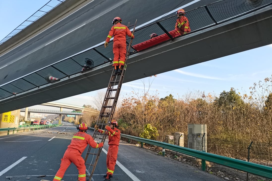 Emergency workers attend the scene of a fatal expressway flyover collapse in Ezhou on Saturday. Photo: Xinhua