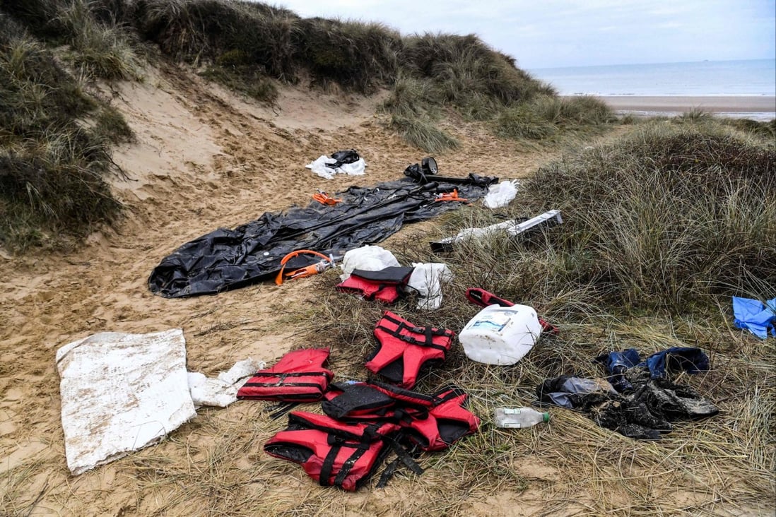 An inflatable boat, life vests and other possessions left on a beach in northern France, photographed on December 20, 2021. An NGO has filed manslaughter charges against French and British officials for failing to help 27 people who drowned in November trying to cross the English Channel. 