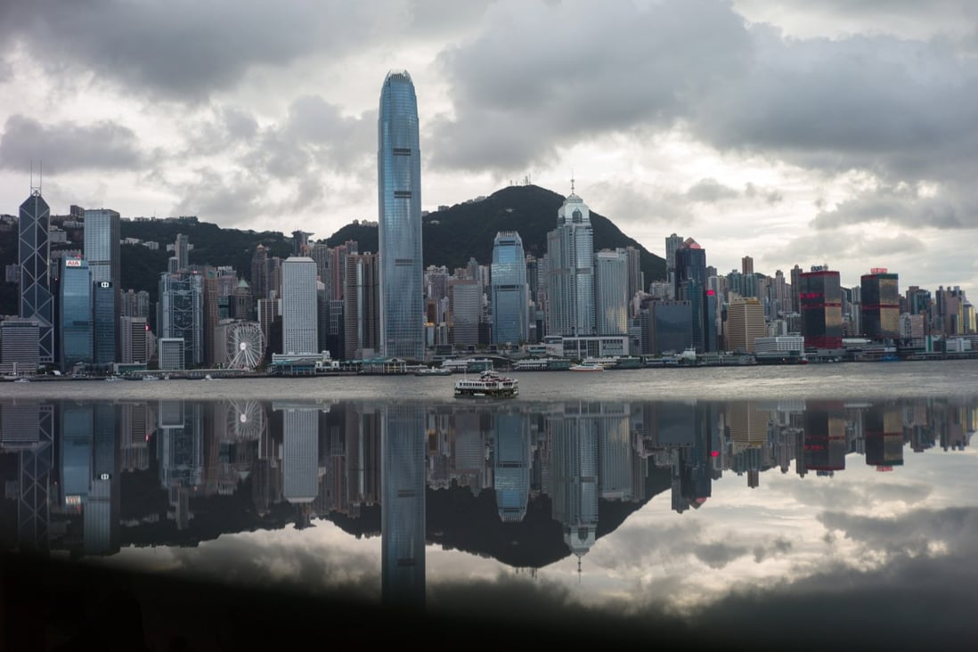 The Hong Kong skyline and Victoria Harbour are reflected in a glass panel on July 12, 2018. The return of stability after the imposition of the national security law, on June 30, 2020, appears to have improved perceptions of Hong Kong’s liveability. Photo: EPA-EFE