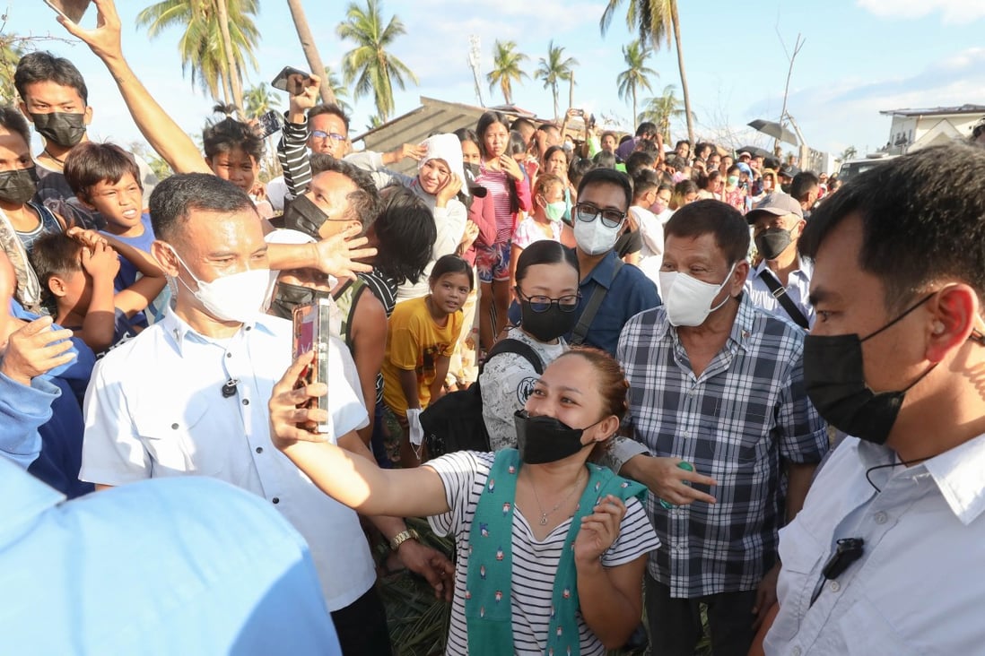 Philippine President Rodrigo Duterte poses for a selfie while inspecting the typhoon-devastated island of Bohol - a key battleground state. Photo: EPA-EFE