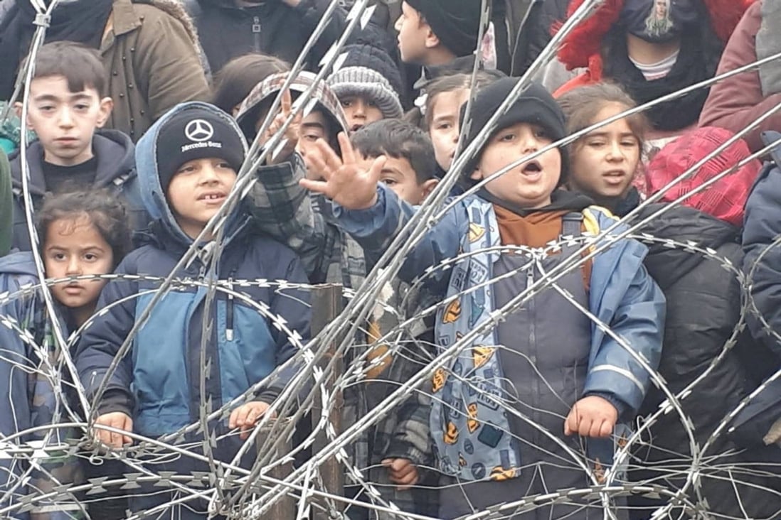 Migrant children gather near the fence on the Poland/Belarus border near Kuznica, Poland, in this video-grab released by the Polish Interior Ministry in November 2021. Photo: via Reuters