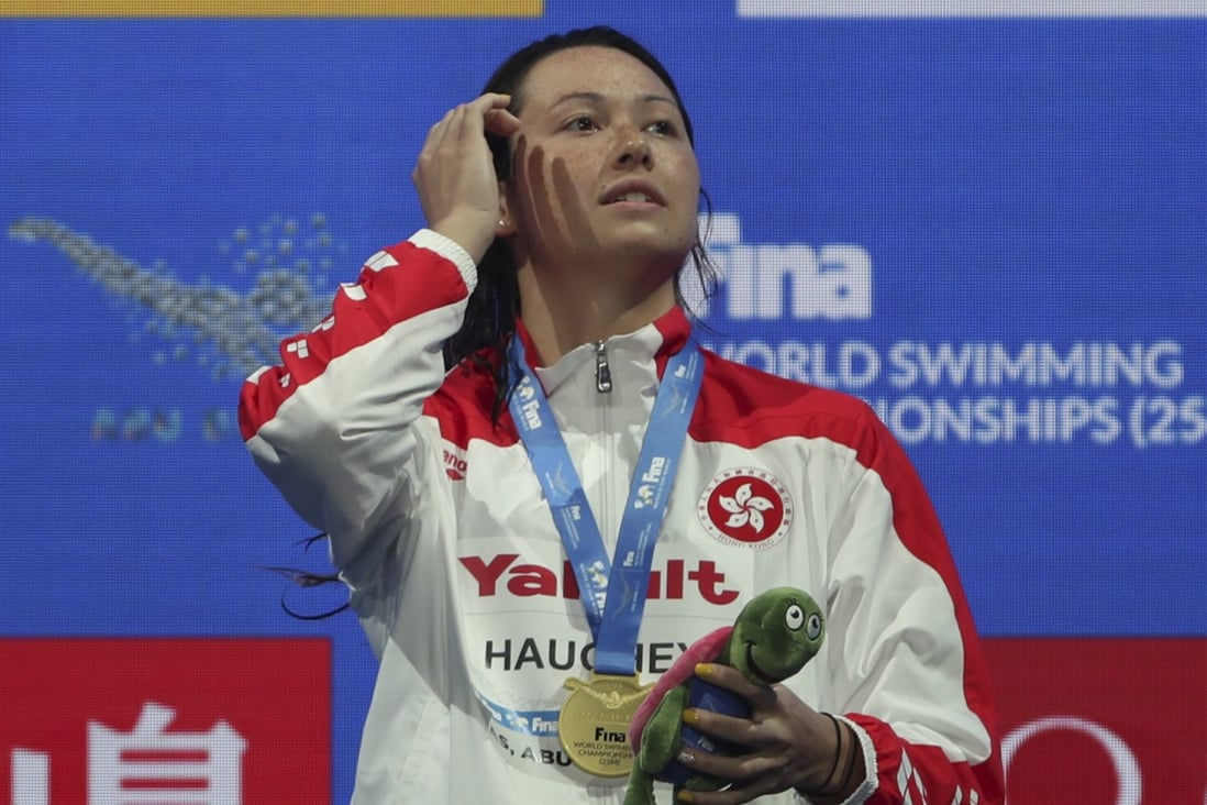 Siobhan Haughey stands on the podium after winning 100m freestyle final at the short course World Championships in Abu Dhabi on December 18, 2021. Photo: AP/Kamran Jebreili)