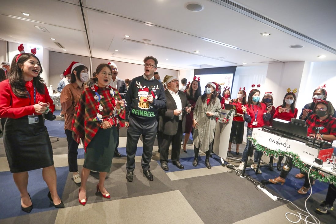 KPMG employees sang Christmas carols during a party at their office in Central in December. Photo: Jonathan Wong
