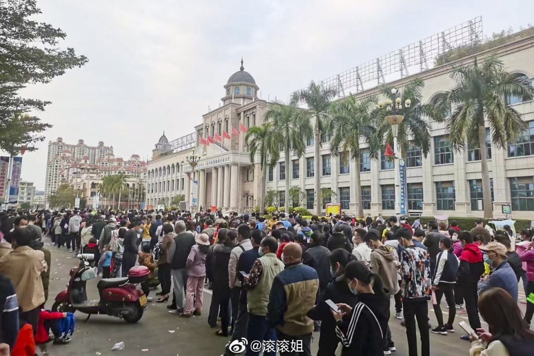 People queue for mass Covid-19 testing in Dongxing, where strict measures have been imposed. Photo: Weibo